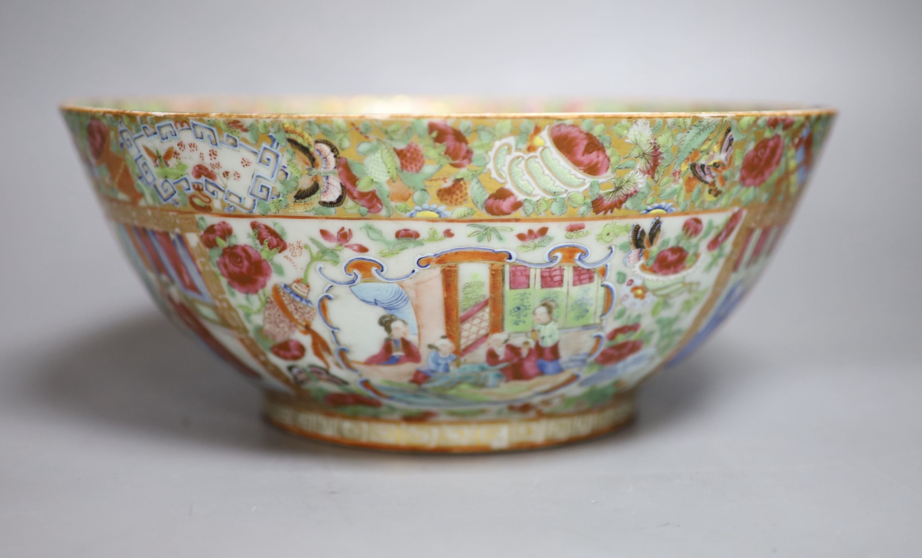 A 19th century Chinese Canton Famille rose punch bowl, c.1830-50, 28cm diameter, repaired